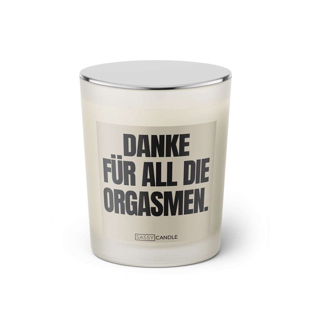 Duftkerze mit witzigen Spruch: Danke für all die Orgasmen. Farbe beige und schwarz von Sassy Candle.