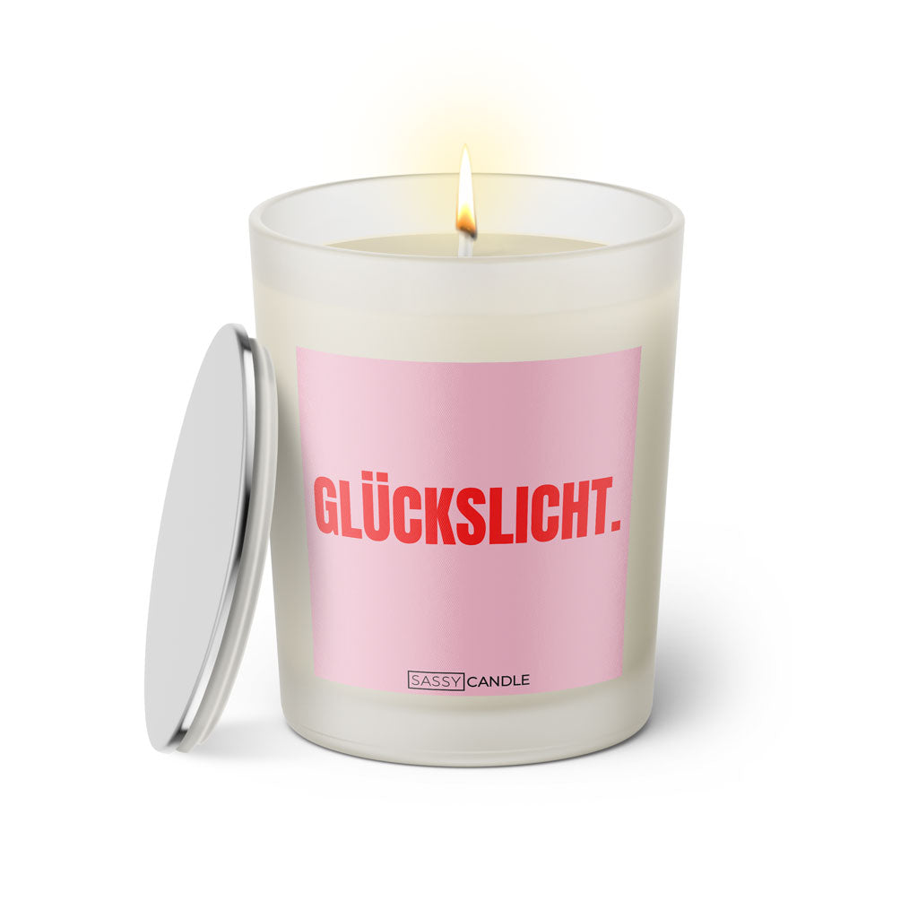 Duftkerze mit witzigen Spruch: Glückslicht. Kerzenglas mit silbernen Deckel. Farbe rosa und pink von Sassy Candle.