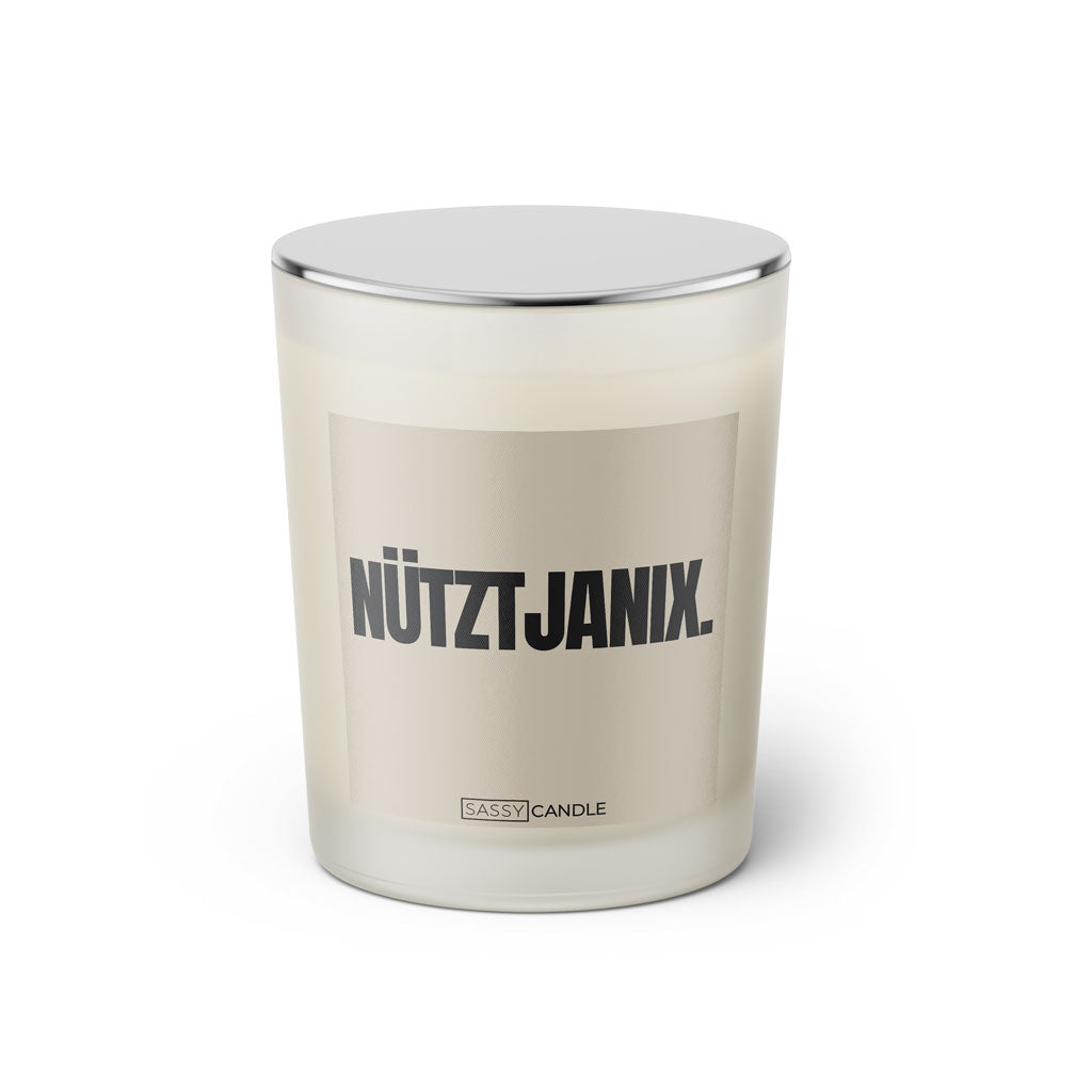 Duftkerze mit Spruch: Nütztjanix. Farbe beige und schwarz von Sassy Candle.