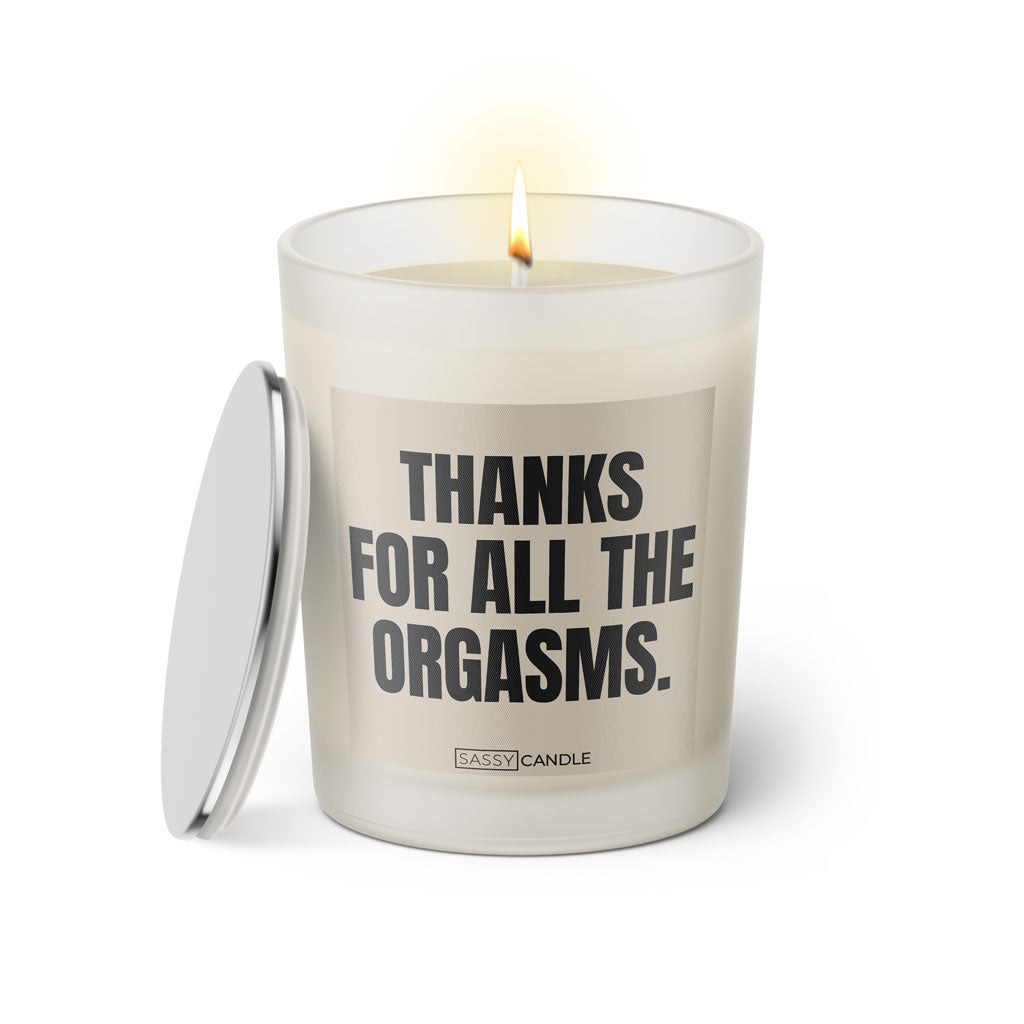 Duftkerze mit witzigem Spruch: Thank you for all the orgasms. Farbe beige und schwarze Schrift. Kerzenglas mit silbernem geschlossenem Deckel von SassyCandle.