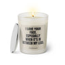 Duftkerze mit Spruch: I love your face. Especially when it's in between my legs. Farbe beige und schwarz von Sassy Candle.