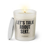 Duftkerze mit witzigem Spruch: Let’s talk about Sekt. Farbe beige und schwarze Schrift. Kerzenglas mit silbernem Deckel von SassyCandle.