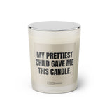Duftkerze mit witzigem Spruch: My prettiest child gave me this candle. Farbe beige und schwarz mit silbernem Deckel von Sassy Candle.