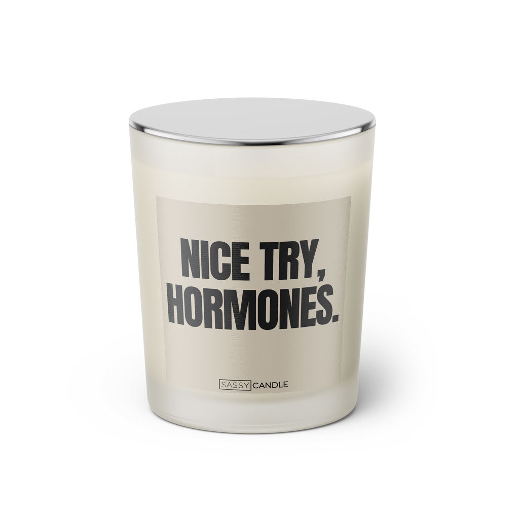 Duftkerze mit Spruch: Nice try, hormones. Farbe beige und schwarz von Sassy Candle.