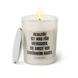 Duftkerze mit witzigen Spruch: Realität ist was für Menschen, die Angst vor Einhörnern haben Farbe beige und schwarz von Sassy Candle.